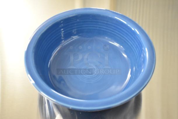 Blue Fiesta ceramic bowl, new with minor imperfections, part of a set of four boxes. Features smooth, glossy finish.