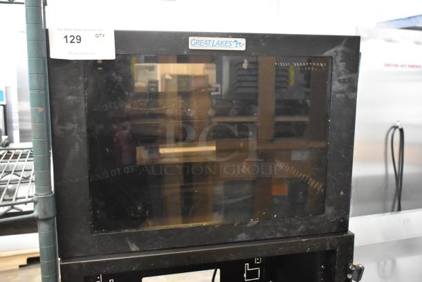 Great Lakes black metal cabinet, one pane missing, used condition, logo on top.