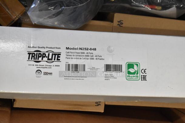 Tripp Lite N252-048 Rack Mount 48-Port Cat6 Patch Panel box with labels. Brand new, ROHS compliant.