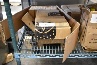 9 brand new Samsara items, including Multiband Antenna and AG46 Asset Gateways, in partially opened boxes on a metal shelf.