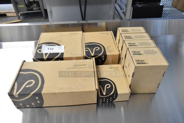 9 brand new, scratch and dent Samsara items: Multiband Antenna, AG46, 5 HW-AG46 Asset Gateways. Labels visible.