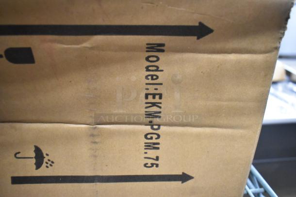 3 new EKM EKM-PGM.75 gas meters in original box, labeled with model and directional symbols.