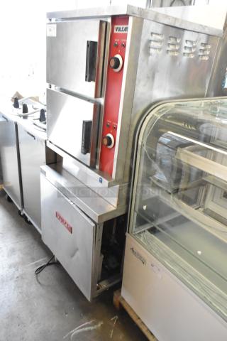 Vulcan stainless steel 2-deck steam cabinet, commercial floor style. Features control knobs. Good condition.
