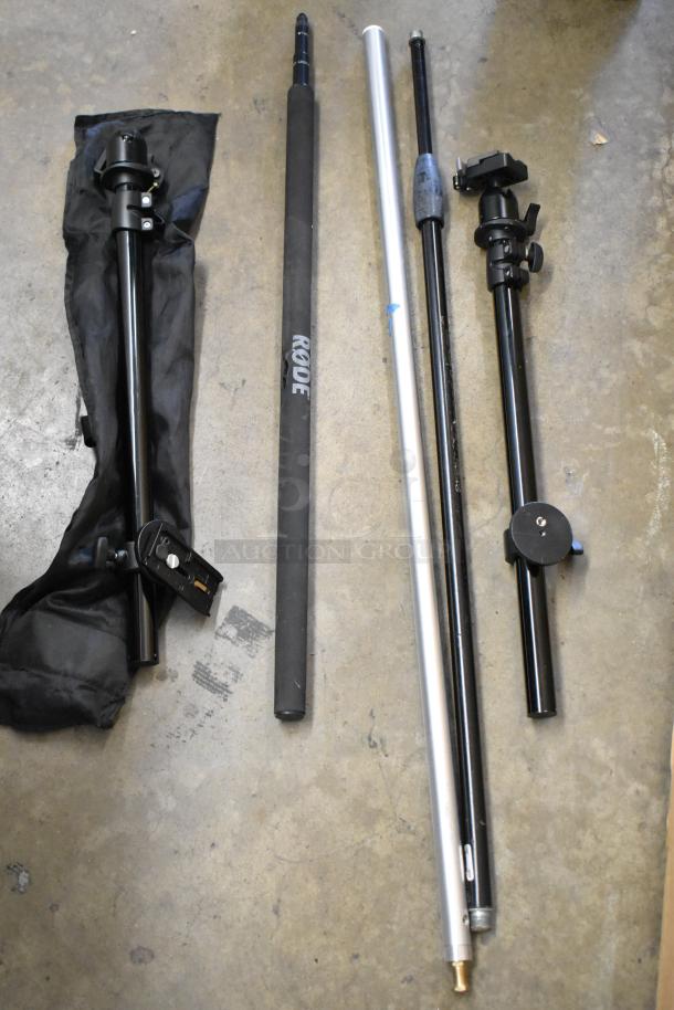 Soft case with contents, including multiple stands and rods, one labeled "RODE." Appears in good condition.