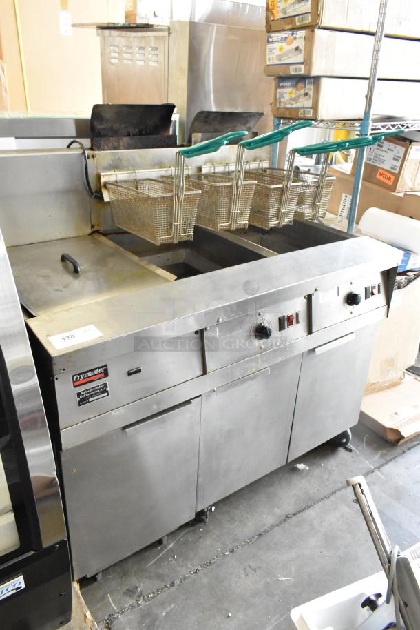 Frymaster FM245ESC 2-bay stainless steel fryer with filtration, dumping station, 4 baskets, 105,000 BTU, on casters.