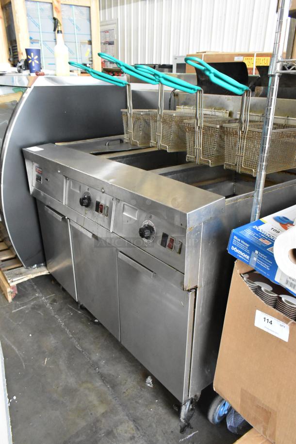 Frymaster FM245ESC commercial stainless steel 2-bay deep fryer with filtration, dumping station, 4 fry baskets, on casters. 105,000 BTU.