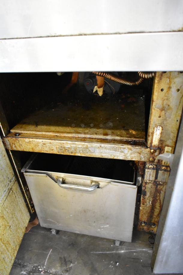 Frymaster FM245ESC fryer, stainless steel, 2 bay, natural gas, filtration, dumping station, 4 baskets, worn condition.