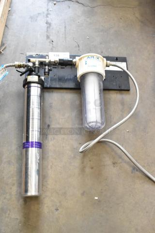 Everpure Kleensteam Water Filtration System, includes filter housing and stainless steel canister, in good condition.
