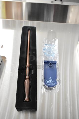 Harry Potter wand in black display box, includes blue "Expecto Patronum" stand.