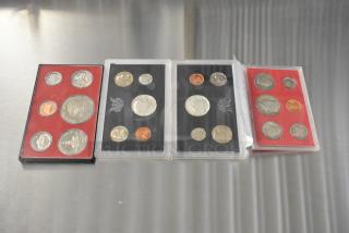 Four US Proof Coin Sets from 1968, 1969, 1975-1976, and 1980 in cases. Coins appear in excellent condition.