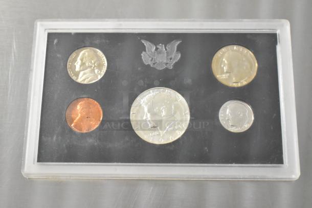 United States Proof Coin Set in plastic case, featuring 1968 coins, visible eagle emblem, excellent condition.