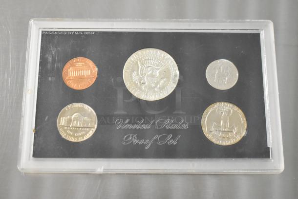1968 United States Proof Coin Set in original packaging, featuring pristine coins with mint markings, showcasing intricate details.