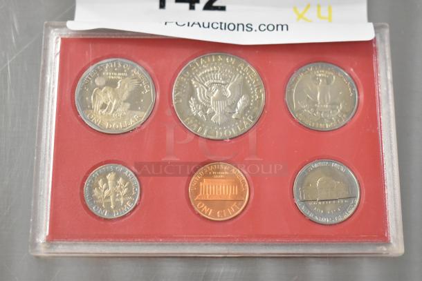 United States Proof Coin Set featuring six coins, 1968-1980, encased in red holder, excellent condition, includes marked $1 coin.
