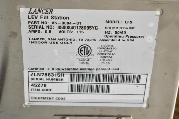 Lancer LFS stainless steel fryer piece, 115 volts, 1 phase. Tag details model, serial number, and assembly info.