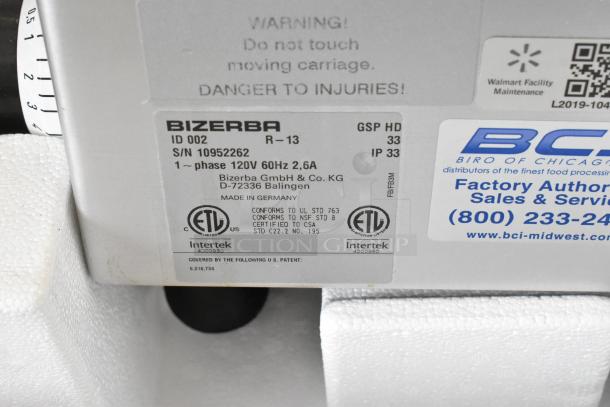 Bizerba GSP HD commercial meat slicer label showing 120V, 1 phase, ETL certification, and factory service contact.