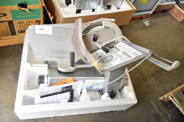 Bizerba SE 12 D US metal commercial meat slicer, 120V, 1 phase, in excellent condition with original packaging and manuals.