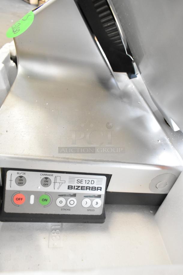 Bizerba SE 12 D US metal meat slicer, 120V, 1 phase. Control panel visible. Commercial-grade condition.