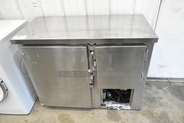 Universal Coolers SC42 Stainless steel 2-door undercounter cooler, 115 volts, 1 phase, visible wear on exterior.