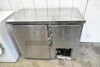 Universal Coolers SC42 Stainless steel 2-door undercounter cooler, 115 volts, 1 phase, visible wear on exterior.