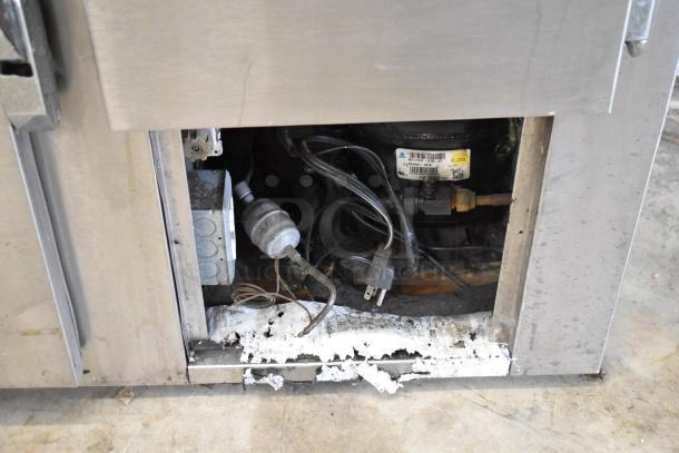 Universal Coolers SC42 stainless steel commercial 2-door undercounter cooler, 115V, internal view. Signs of wear visible.