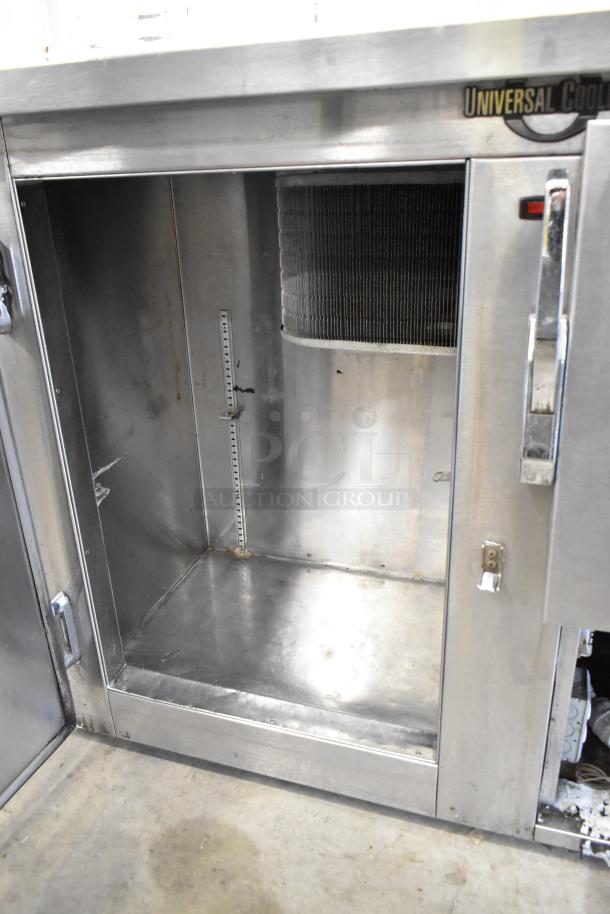 Universal Coolers SC42 stainless steel 2-door undercounter cooler, 115V, 1 phase. Clean interior, visible shelf slots.