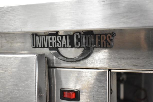 Universal Coolers SC42 stainless steel 2-door undercounter cooler, 115V, 1 Phase. Features brand logo and red power indicator.