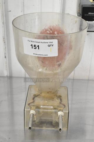 Clear poly pastry filler hopper with two spouts, no lid. Used condition with visible residue. Auction tag reads "151, QTY 1".