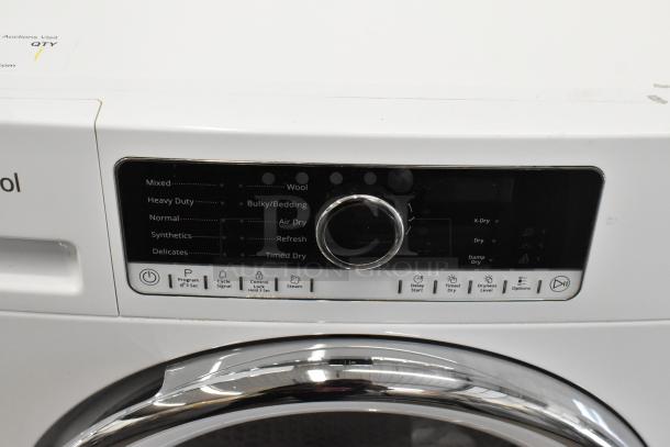 Whirlpool metal front load dryer with digital controls, multiple drying modes, and chrome-trimmed door in excellent condition.