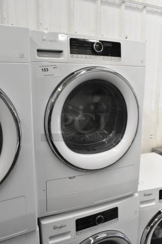 Whirlpool front load metal dryer, white, control panel, chrome trim, visible label "153", modern design, good condition.