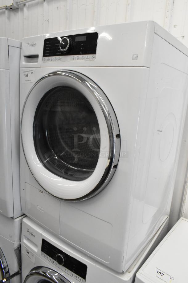 Whirlpool front load dryer, metal finish, with control panel and door. Model label visible. Slight wear, good condition.