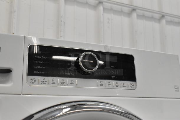 Whirlpool front load dryer, metal finish, control panel with rotary dial, programs include Mixed, Heavy Duty, Synthetics, Delicates.
