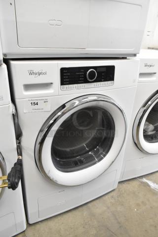 Whirlpool front load metal dryer with control panel, chrome trim, and viewing window. In good condition with label tag "154".