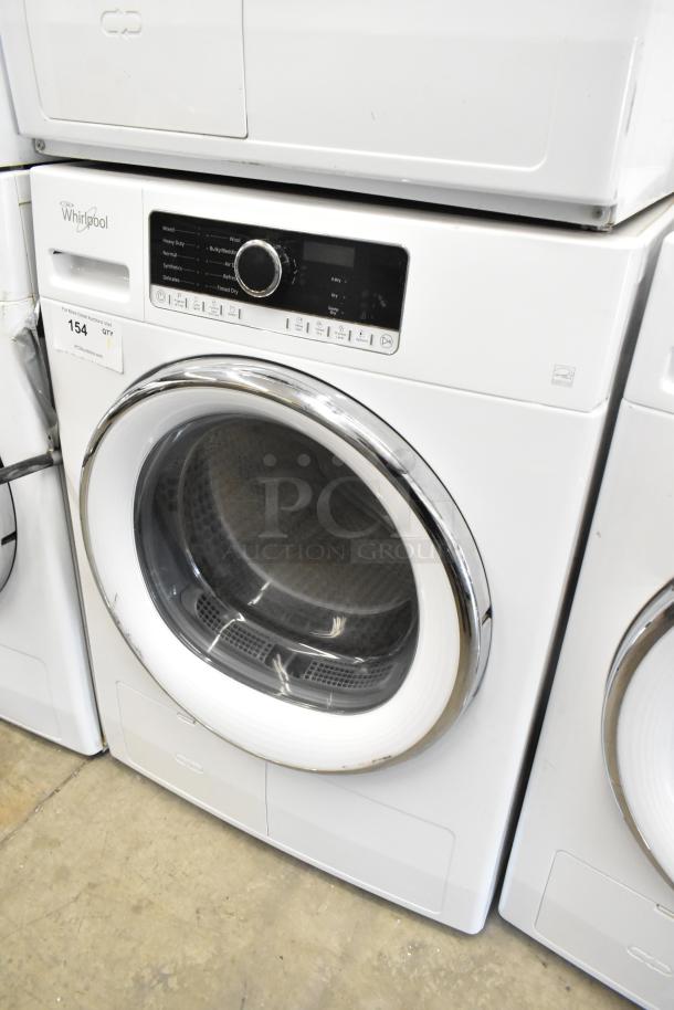 Whirlpool front load dryer, metal finish, excellent condition. Features control panel with multiple settings. Model info not visible.