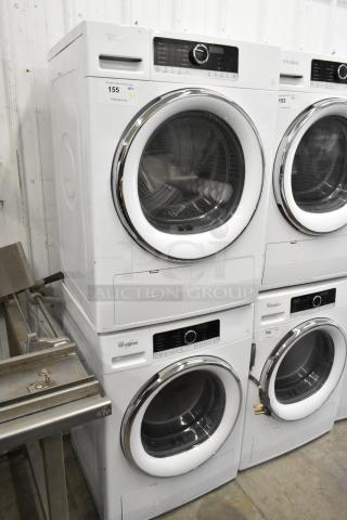 2 Whirlpool front load dryers, metal, stacked, with digital controls. Excellent condition, auction quantity tag visible.