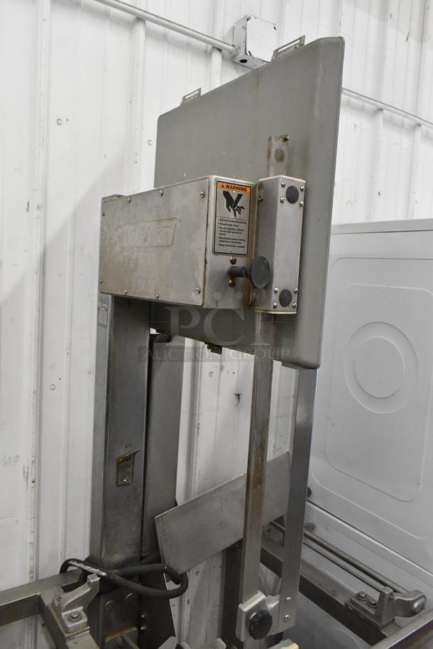 Hobart 6801 metal commercial meat saw, floor style. Features 200-230 volts, 3 phase. Visible warning label.