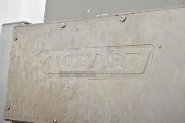 Hobart 6801 metal commercial floor style meat saw, showing worn surface and embossed brand logo.