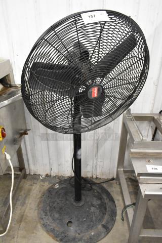Dayton 2LY97B black metal floor fan, 120V, 1 phase, in used condition with visible label on base and body.