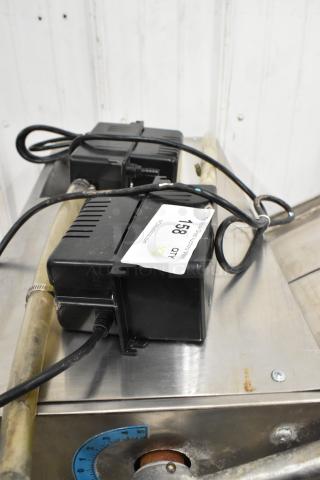 2 Beckett CB121LSUL pumps, 115 volts, 1 phase, shown on a metallic surface with power cables. Quantity label reads "158, QTY x2".