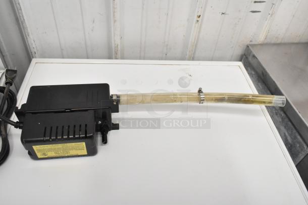 Beckett CB121LSUL Pump, black, 115 volts, 1 phase, with hose and metal clamp; yellow label with specs. Includes two units.