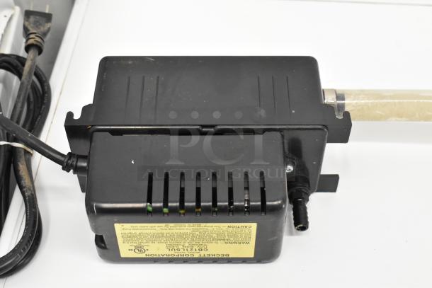 Beckett CB121LSUL Pump, 115 Volts, 1 Phase, black casing, visible label indicating specifications, includes power cord.