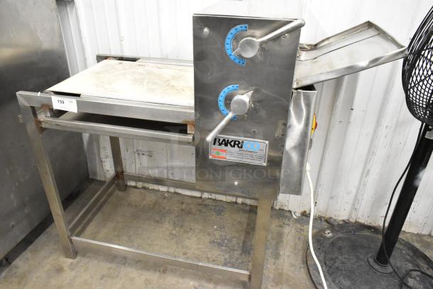 Bakri Co metal commercial floor-style dough sheeter, 250 volts, used condition, visible brand label and control knobs.