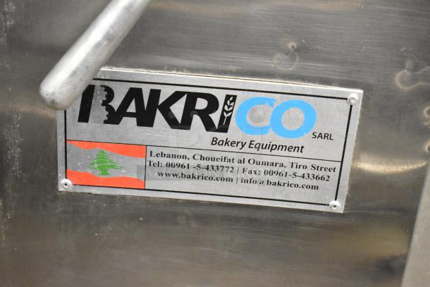 Bakri Co metal dough sheeter, floor style, 250 volts. Features branding and contact info. Good condition.