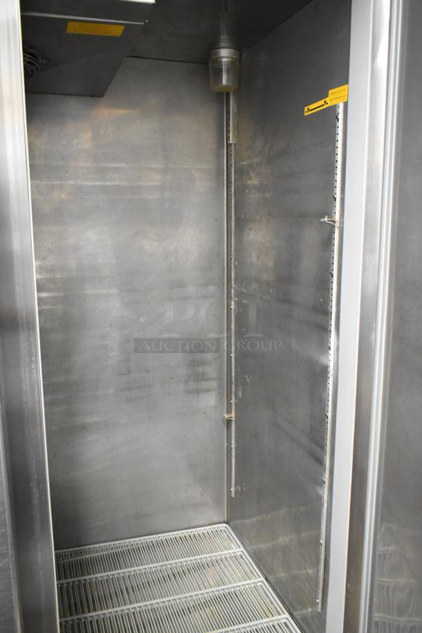 Fagor QR-2 stainless steel 2-door reach-in cooler interior, shelves installed, commercial-grade, on casters, 115V, 1 phase.