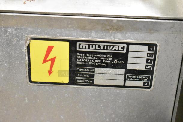 Multivac A300/22 commercial vacuum sealer, metal body, 220V, 1 phase. Features label with power specs and German origin.
