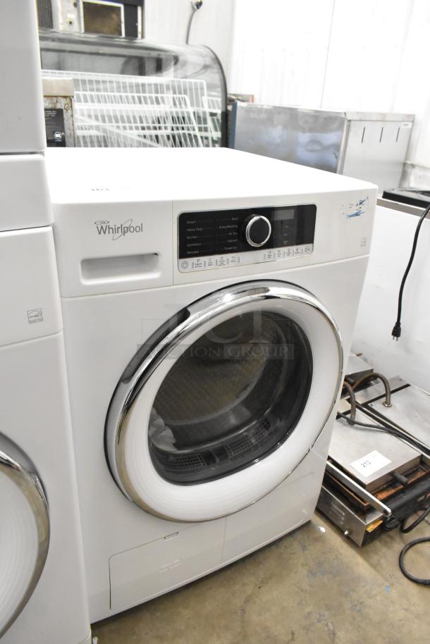 Whirlpool front load dryer, metal finish, 120 volts, 1 phase. Features control panel, chrome door trim. Good condition.