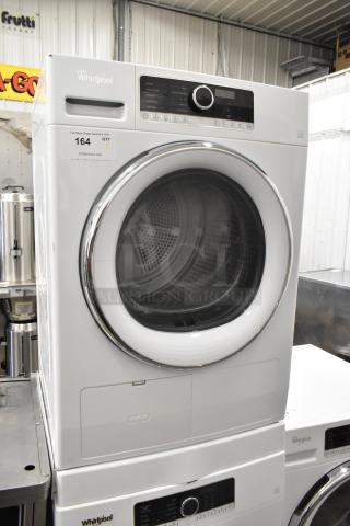 Whirlpool front load dryer, metal finish, 120V, 1 phase, digital control panel, excellent condition, model label visible.