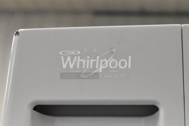 Whirlpool front load dryer, metal finish. Features 120 volts, 1 phase. Slight wear on edges. Logo visible.