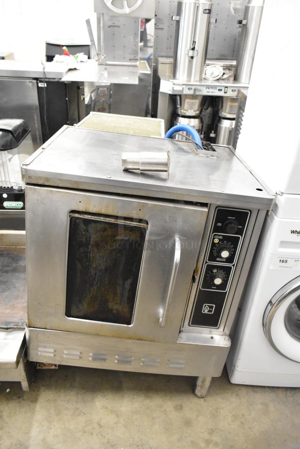 Blodgett stainless steel commercial gas convection oven with view-through door, metal racks, and thermostatic controls.