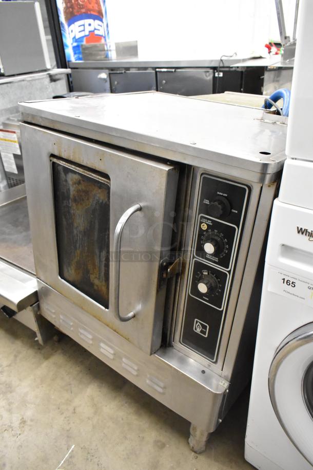 Blodgett stainless steel gas convection oven with view-through door, metal racks, and thermostatic controls; used condition.