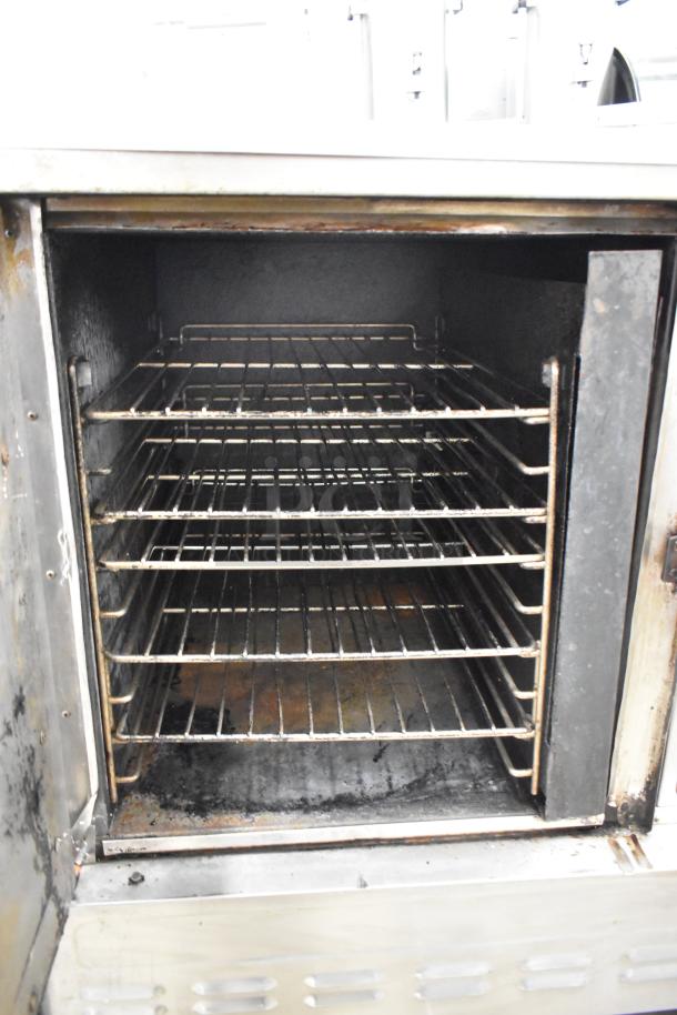 Blodgett stainless steel commercial gas convection oven with view-through door, metal racks, and thermostatic controls.